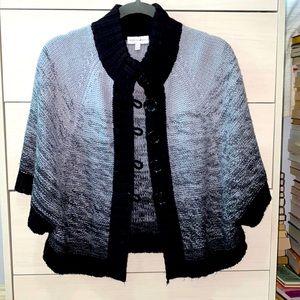 Ombré grey and black sweater shawl.